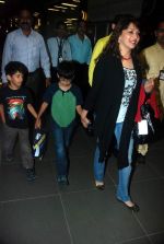 Madhuri Dixit snapped with kids and husband at the airport in Mumbai on 1st Jan 2012
